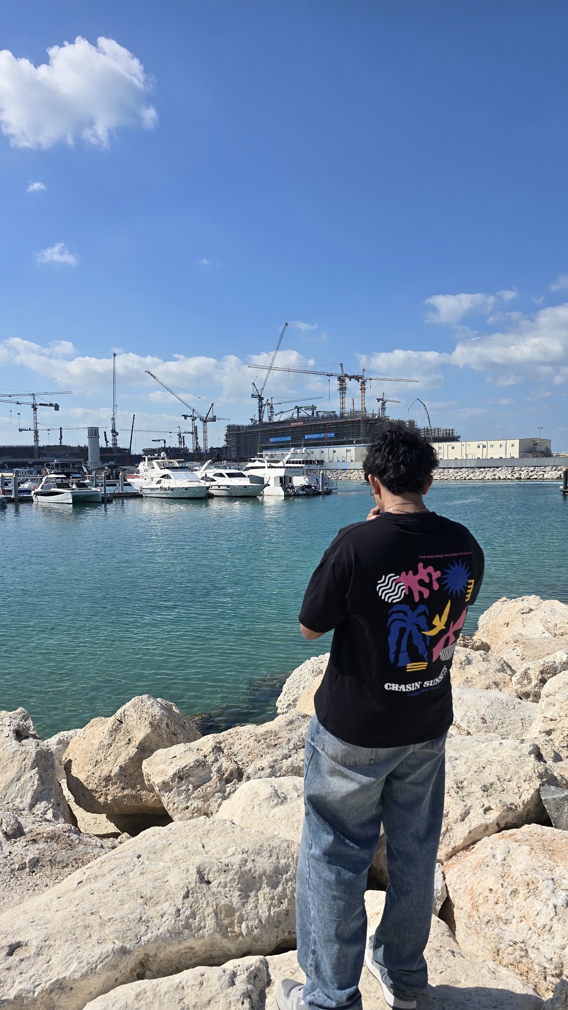 Raashid Ambel on location by the water, United Arab Emirates