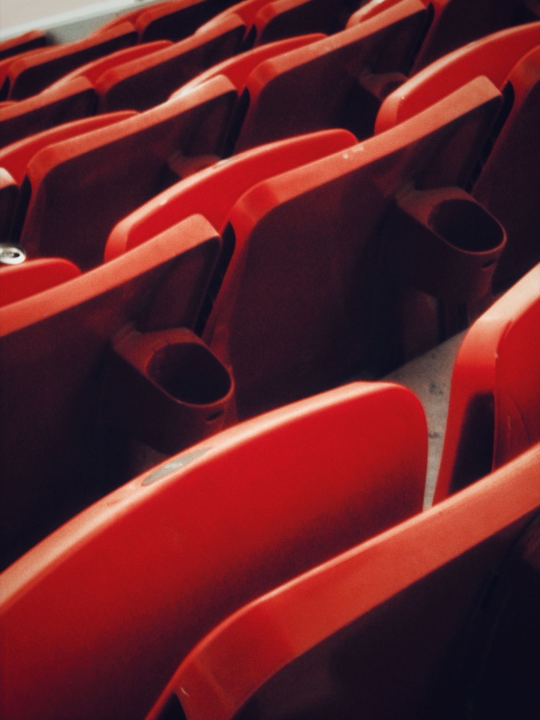 Repeating pattern of red cinema seating