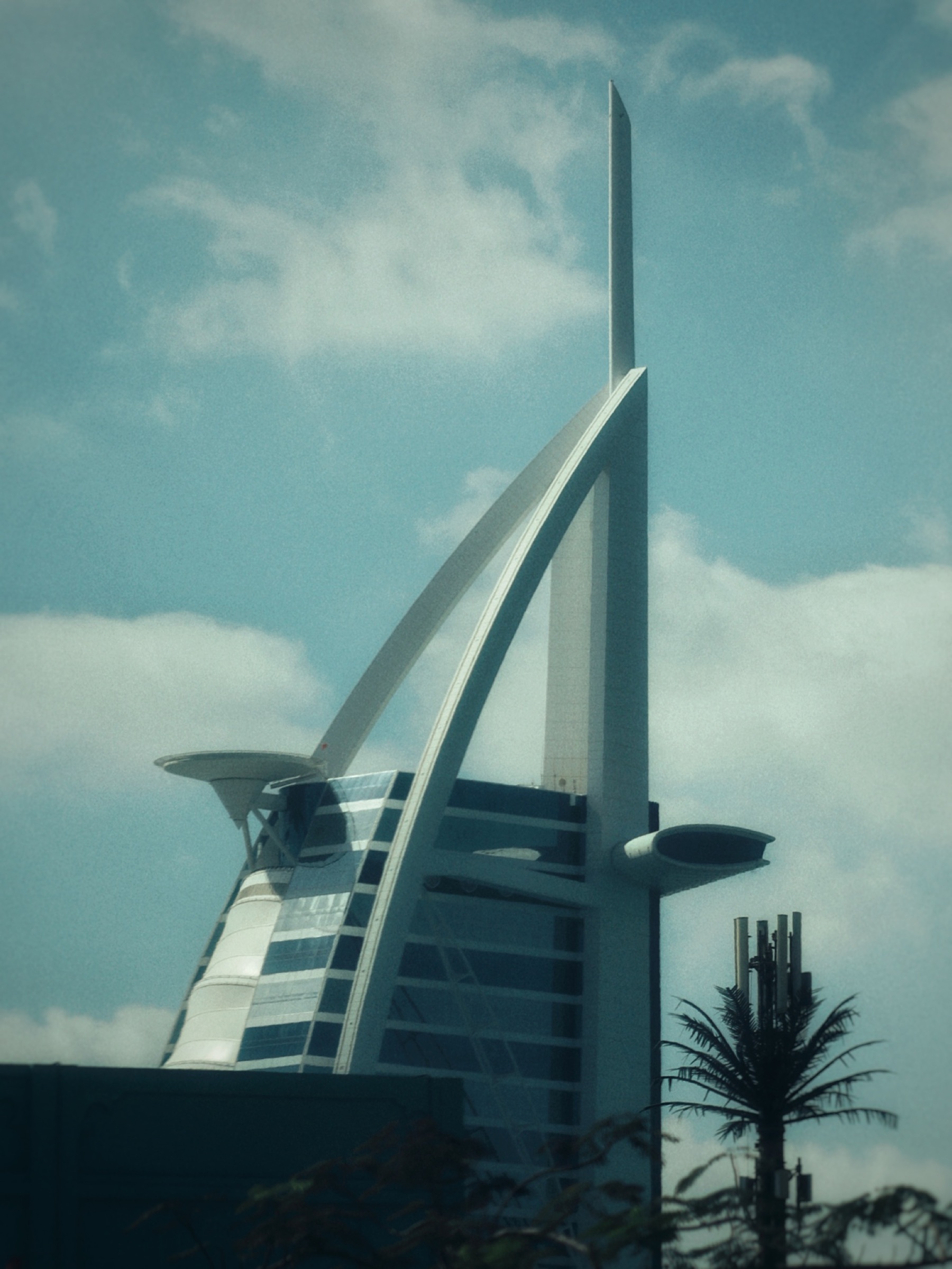 Burj Al Arab's sail-shaped silhouette against the sky