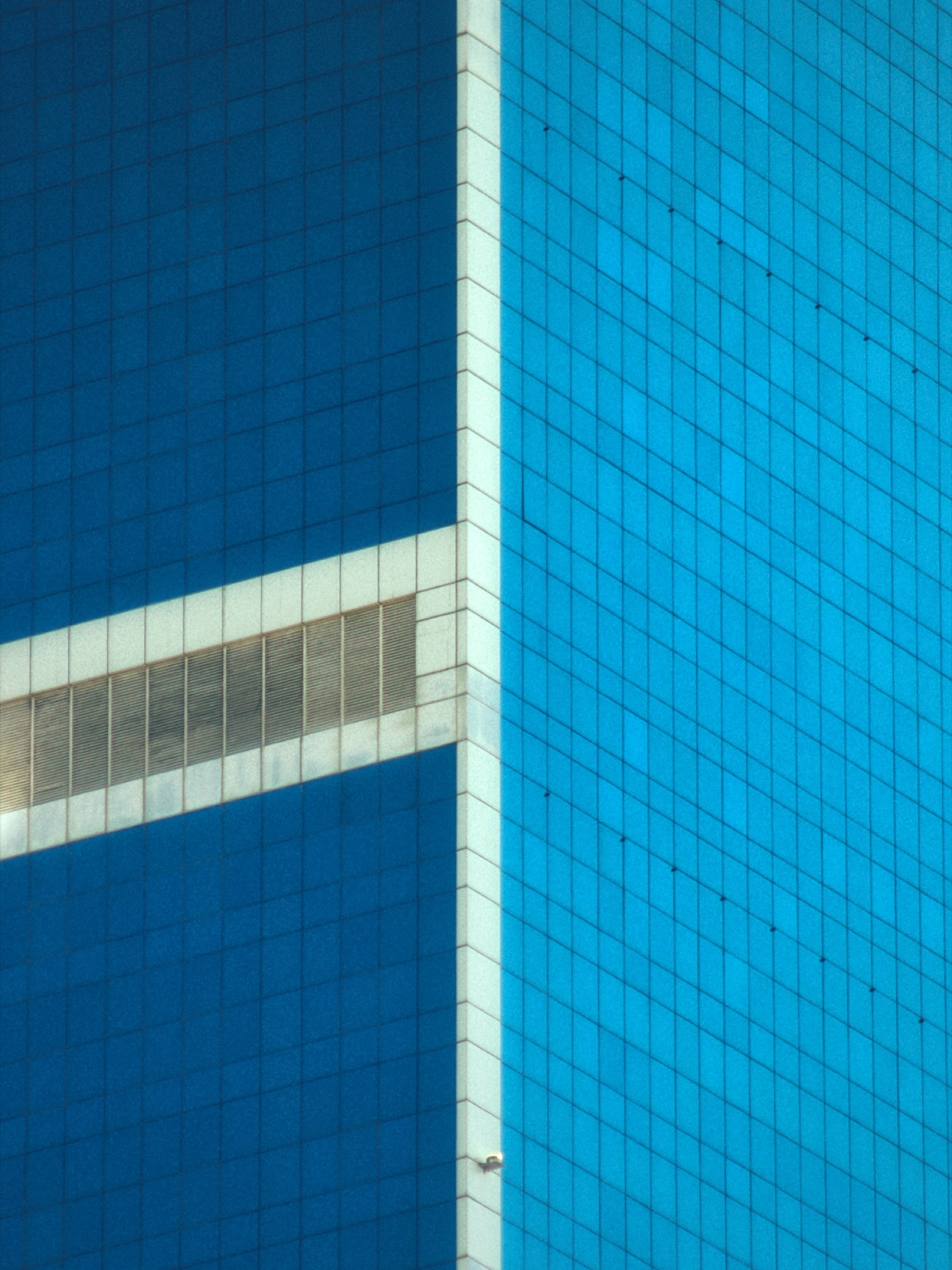 Blue glass skyscraper corner detail