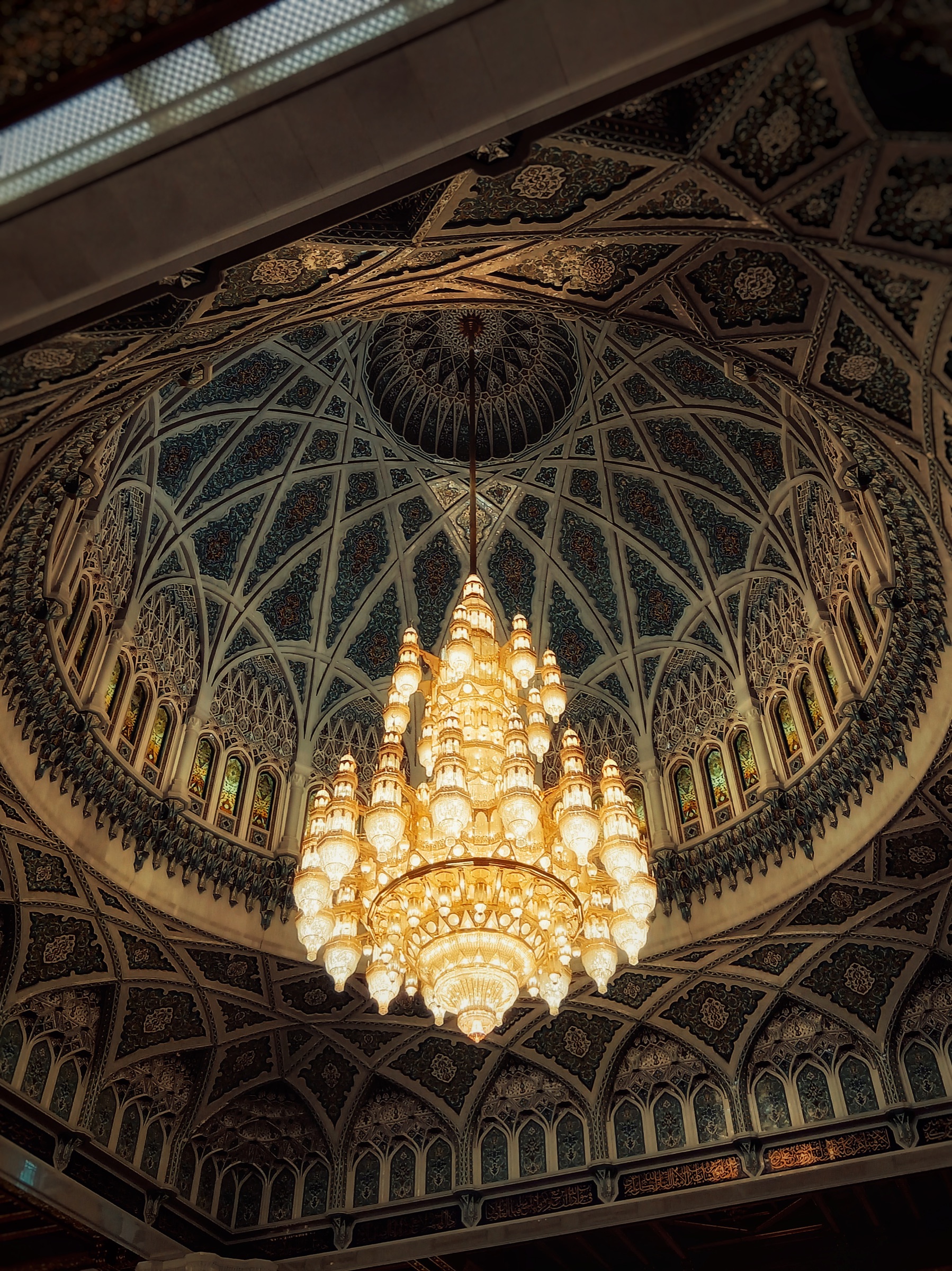 Ornate mosque dome ceiling with chandelier