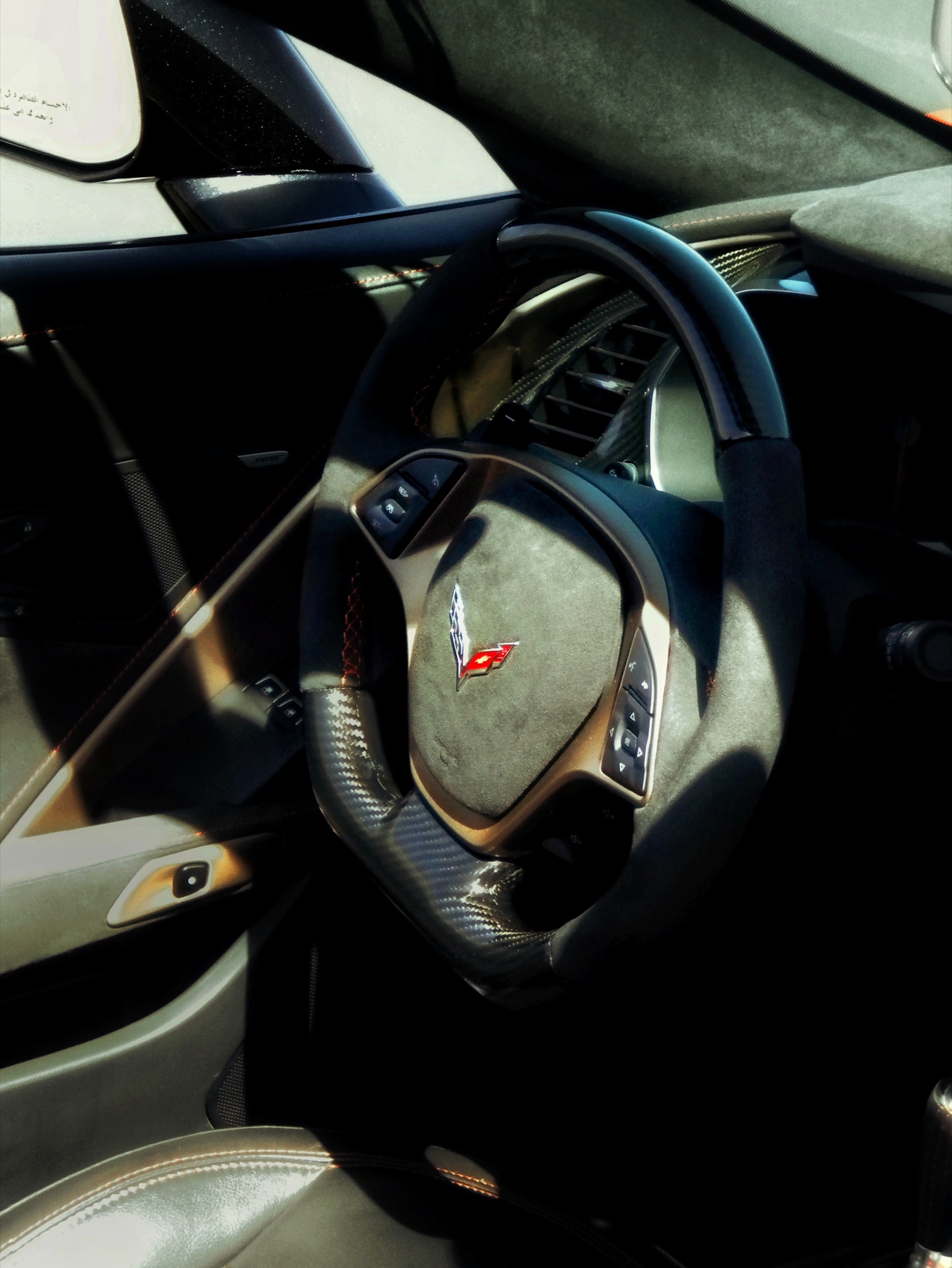 Macro study of a Corvette's steering wheel and cabin detail