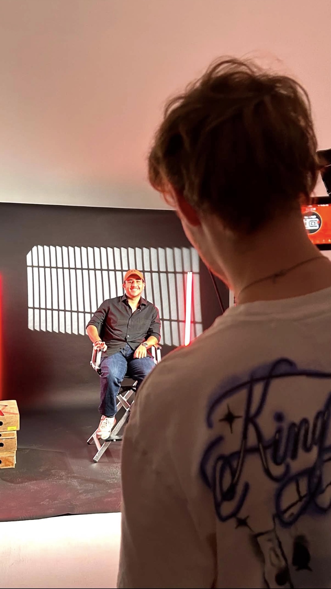 Crew filming the director on set for the documentary