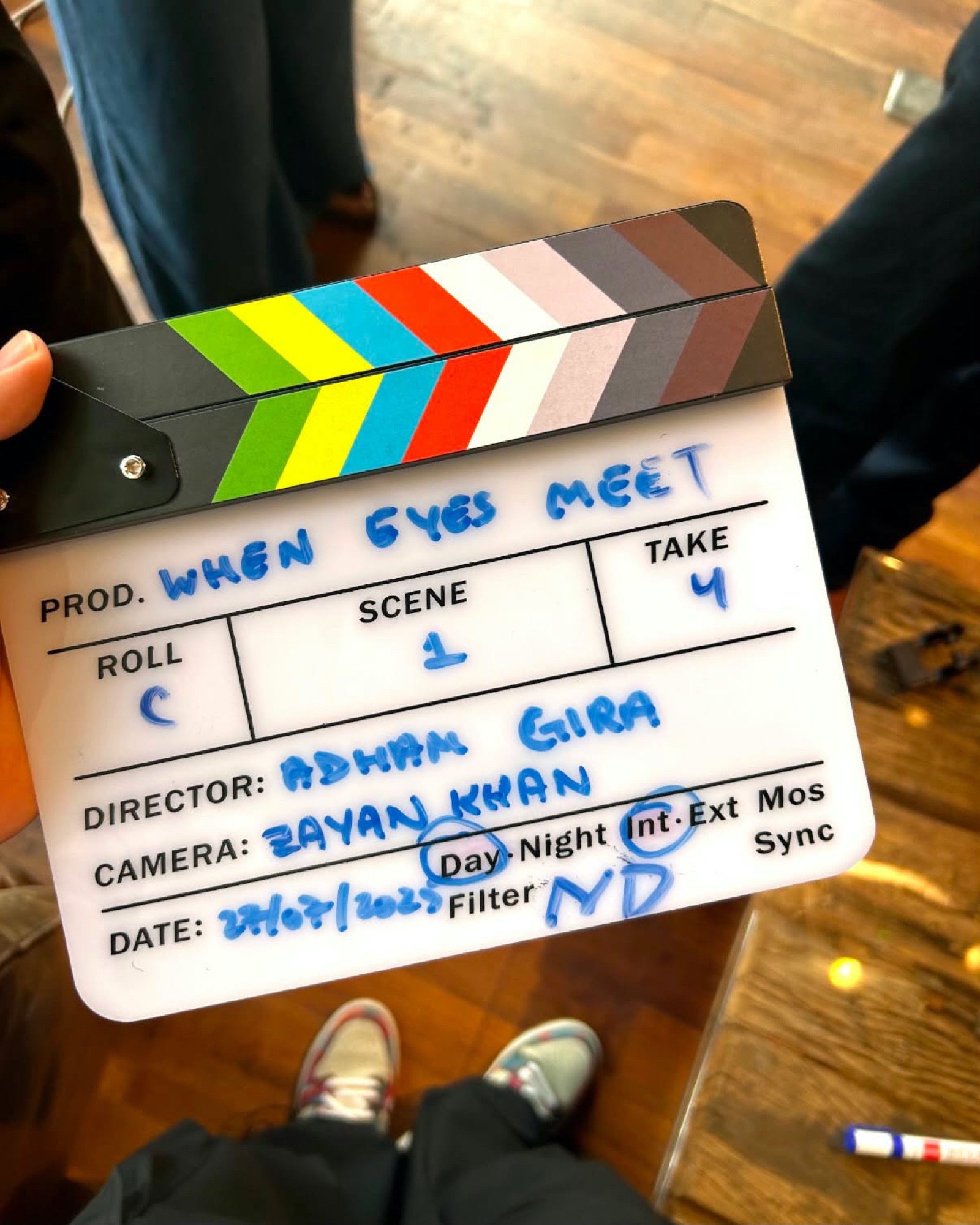 Slating a take with the clapperboard on the set of When Eyes Meet